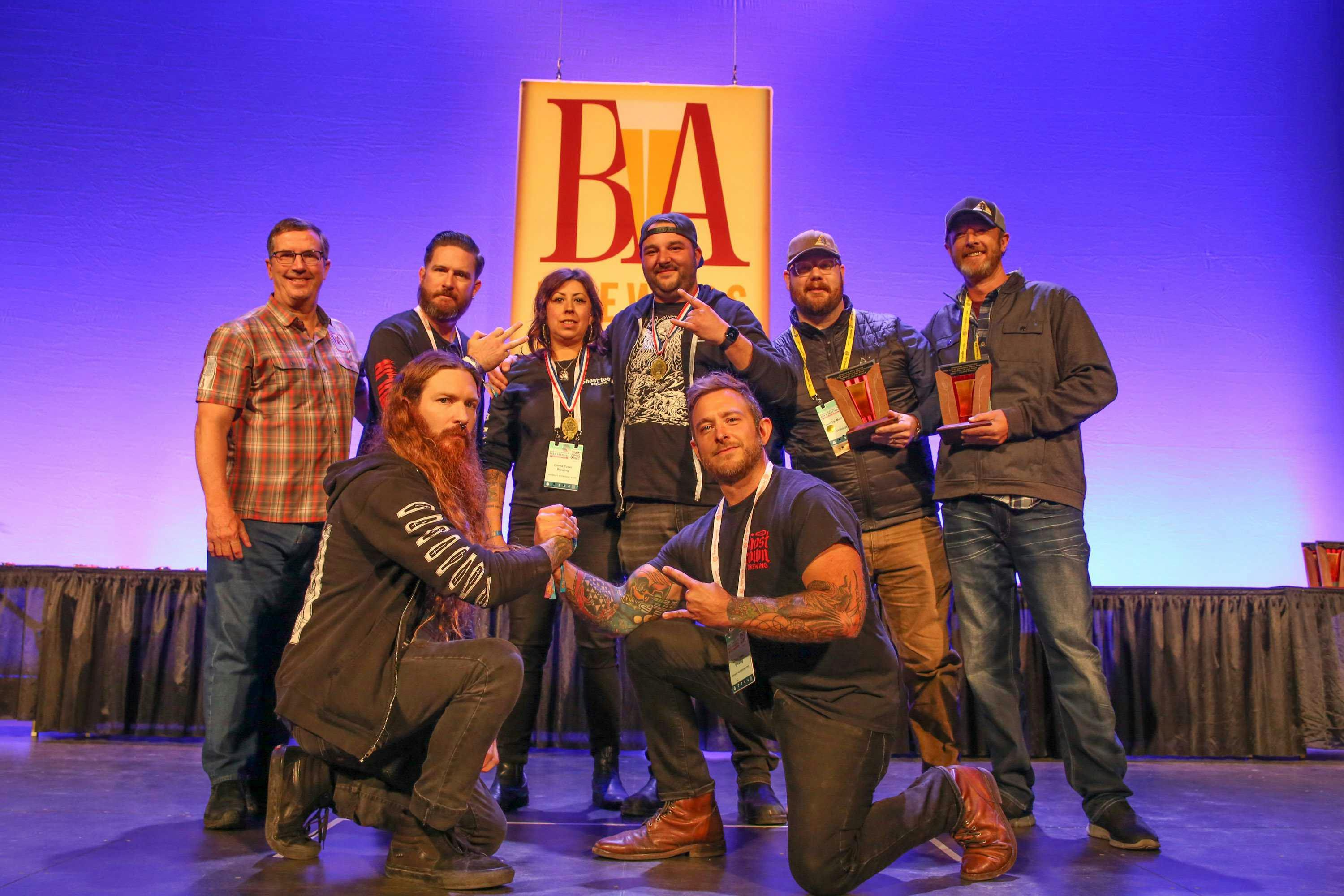 The Ghost Town team poses with their winning medals and trophies at the 2022 Great American Beer Festival